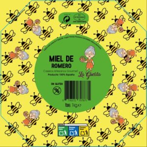 Tarro de miel de romero artesanal La Guelita de 1 kg junto a flores frescas de romero