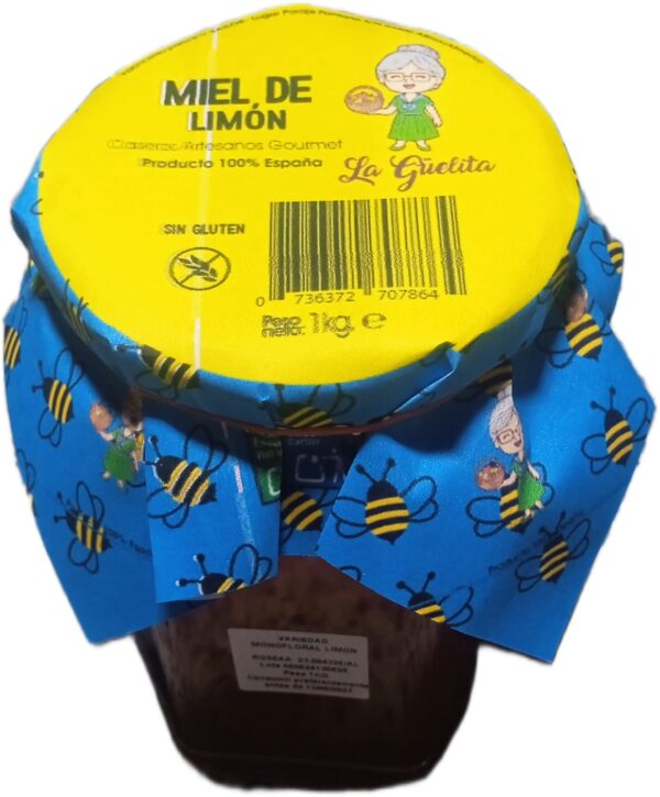 Tarro de miel de limón artesanal La Guelita 1 kg con rodajas de limón y flores silvestres